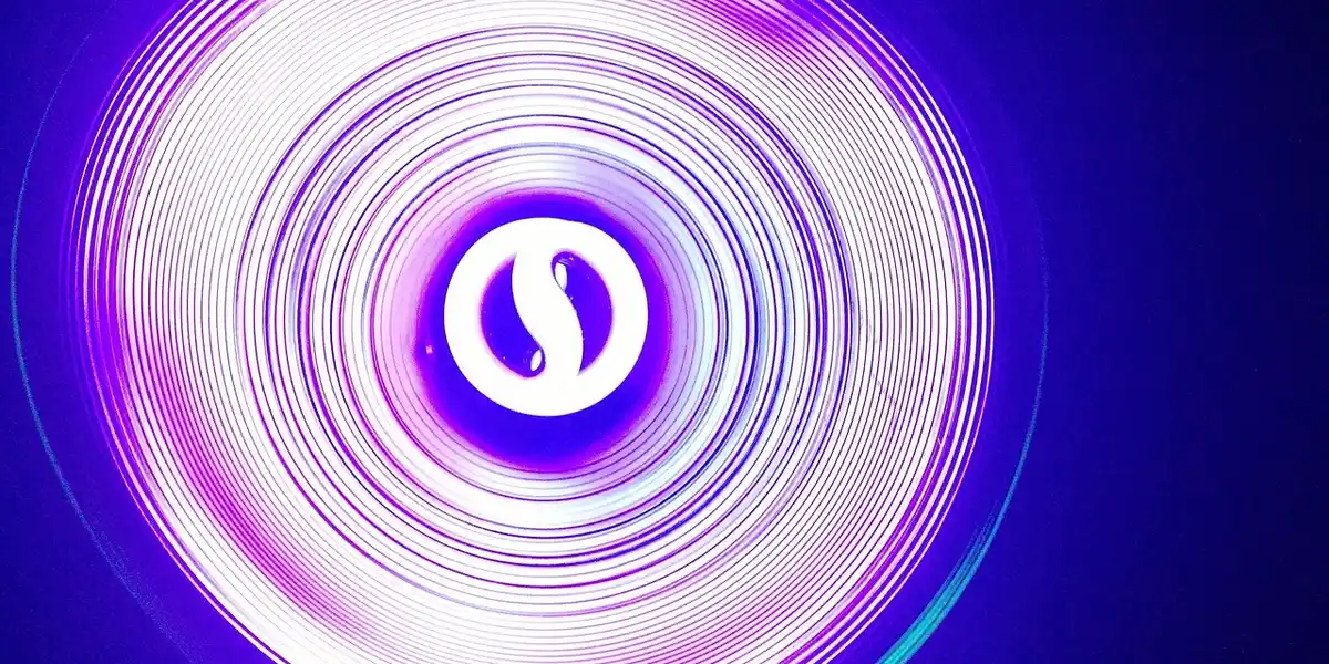 Purple circular LED light with concentric rings and a white central logo, representing modern reptile enclosure lighting.