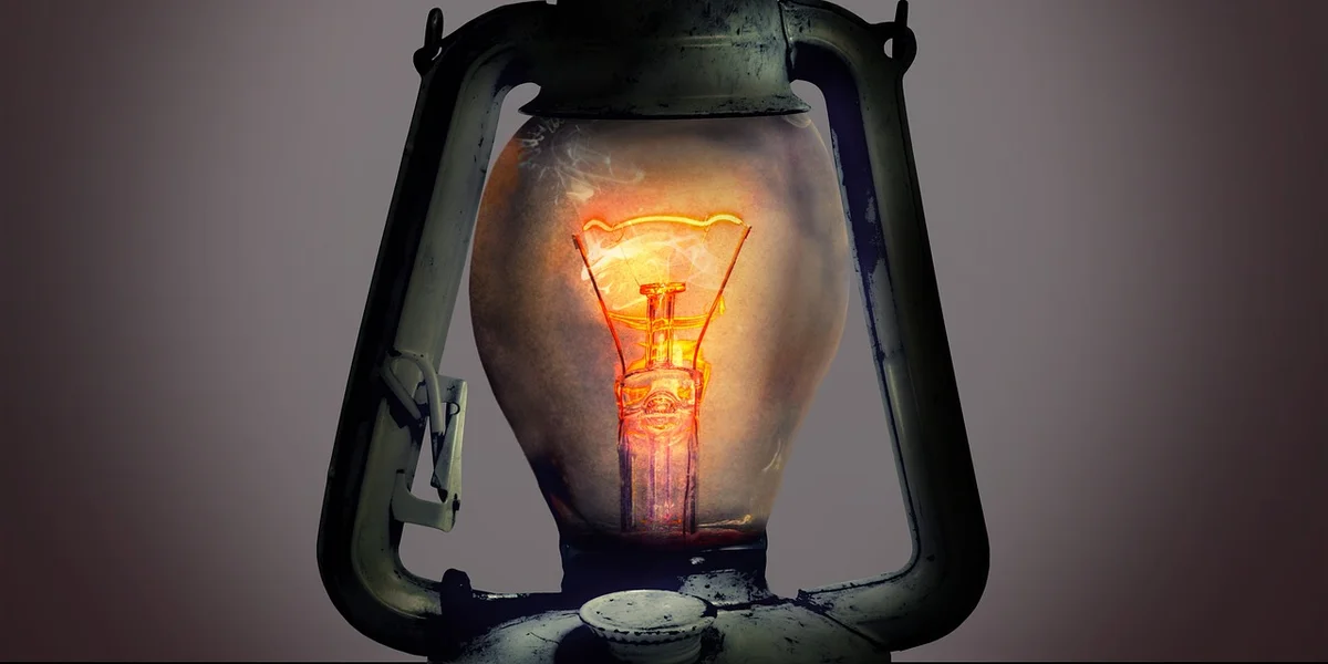 Vintage lantern glowing softly in the dark