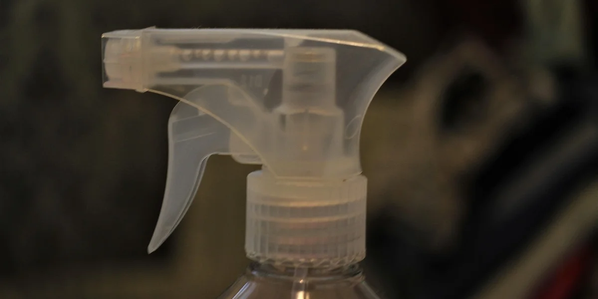 Close-up of a spray bottle nozzle used for misting leopard geckos.
