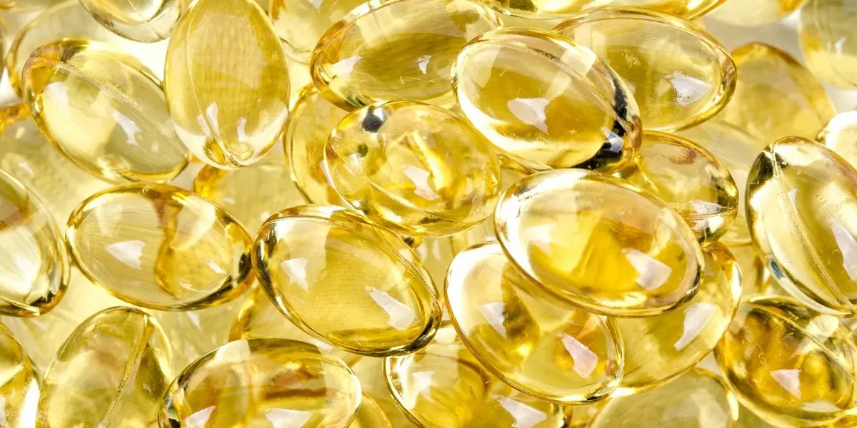 Close-up of yellow vitamin D3 softgel capsules